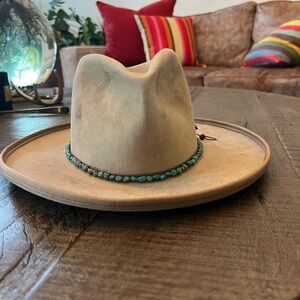 Unisex Custom made Nick Fouquet hat with turquoise band and Thunderbird pin.